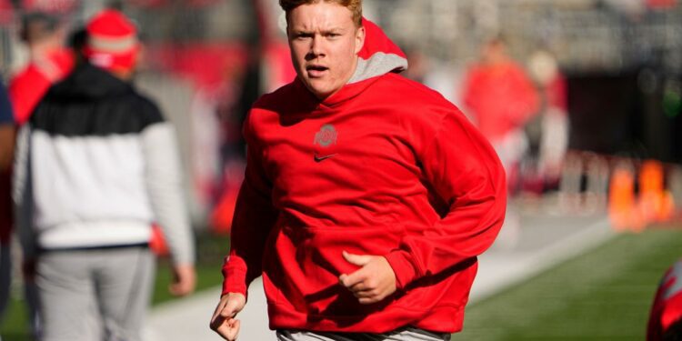 Nov 26, 2022; Columbus, Ohio, USA; Ohio State Buckeyes quarterback Devin Brown (15) warms up prior to the NCAA football game against the Michigan Wolverines at Ohio Stadium. Mandatory Credit: Adam Cairns-The Columbus Dispatch