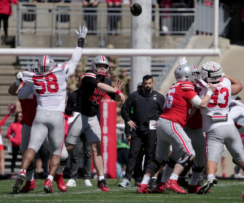 April 13, 2024; Columbus, Ohio, USA; 
Ohio State Buckeyes quarterback Will Howard (18) thorws a pass while playing for the scarlet team during the first half of the LifeSports spring football game at Ohio Stadium on Saturday.