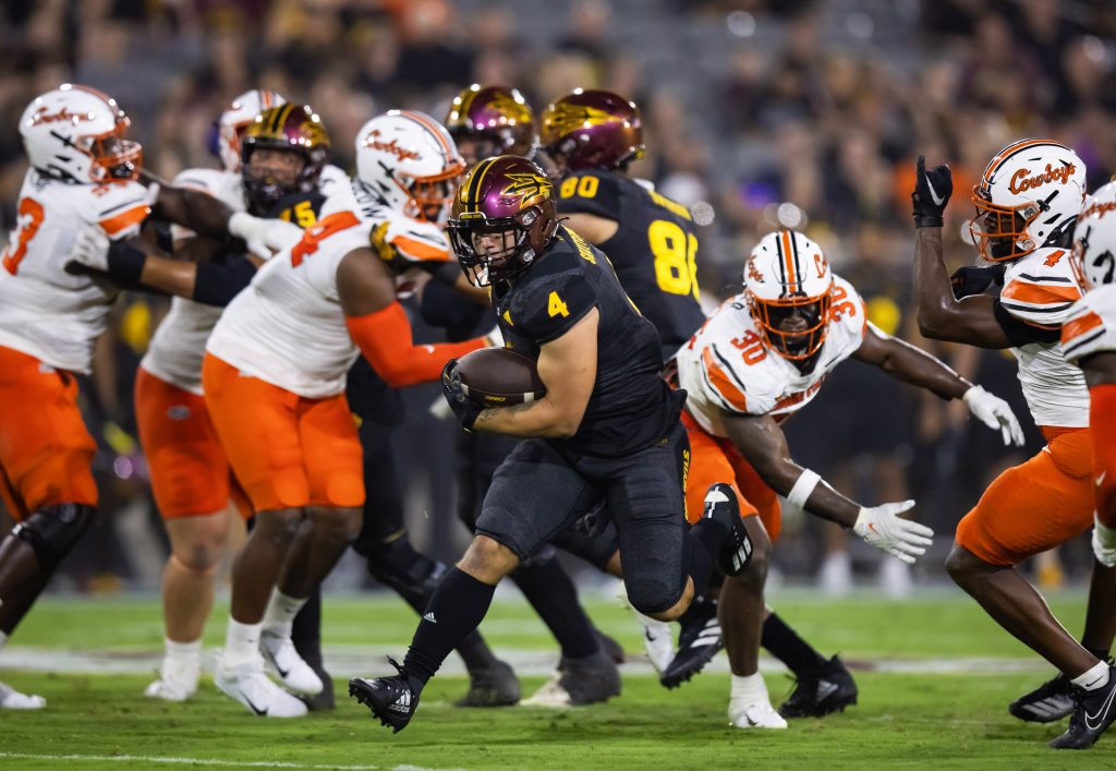 Sep 9, 2023; Tempe, Arizona, USA; Arizona State Sun Devils running back Cam Skattebo (4) against the Oklahoma State Cowboys at Mountain America Stadium. Mandatory Credit: Mark J. Rebilas-USA TODAY Sports