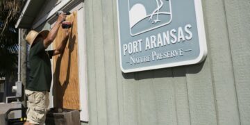 A worker boards up windows at the Port Aransas Nature Preserve office ahead of Beryl's landfall in Port Aransas, Texas, July 6, 2024. - Eddie Seal/Bloomberg/Getty Images