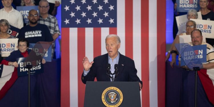 Biden heads to Detroit as pressure mounts