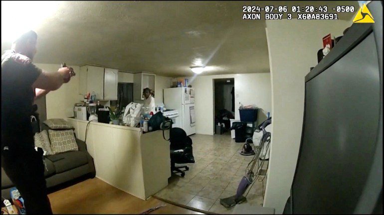 Sangamon County Sheriff's Deputy Sean Grayson points his weapon at Sonya Massey before shooting her, during a call for help at her home July 6 captured on a still photograph from body camera video released by the Illinois State Police July 22, 2024. Illinois State Police/Handout via REUTERS. THIS IMAGE HAS BEEN SUPPLIED BY A THIRD PARTY