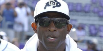 Deion Sanders wearing a Colorado hat