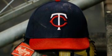 A Minnesota Twins hat in the dugout