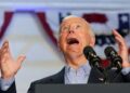 U.S. President Joe Biden looks up with his mouth open during a campaign event at Sherman Middle School