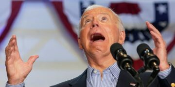 U.S. President Joe Biden looks up with his mouth open during a campaign event at Sherman Middle School