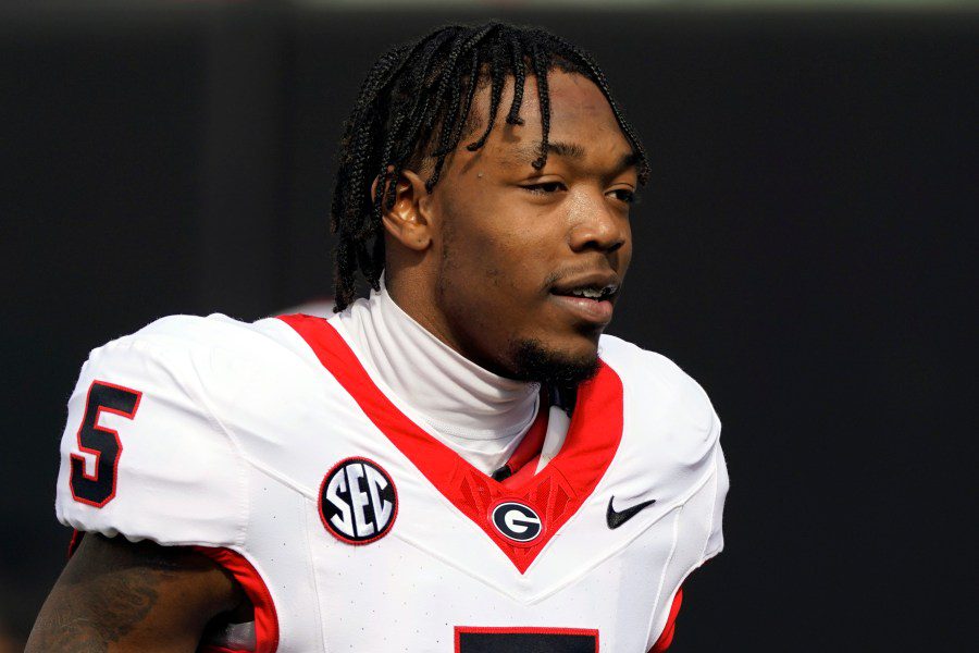 FILE - Georgia wide receiver Rara Thomas (5) warms up before an NCAA college football game against Vanderbilt, Saturday, Oct. 14, 2023, in Nashville, Tenn. Thomas was arrested on charges of cruelty to children and battery early Friday, July 26, 2024, in Athens, Ga., adding to the team's recent legal woes. (AP Photo/George Walker IV, File)