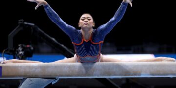 FILE - Suni Lee competes on the balance beam at the U.S. Gymnastics Championships, Friday, Aug. 25, 2023, in San Jose, Calif. Olympic gymnastics all-around champion Suni Lee revealed this week that at the height of a mystery kidney ailment last year, she gained around 45 pounds in water weight that made her question whether a return to top form was even possible. (AP Photo/Jed Jacobsohn, File)