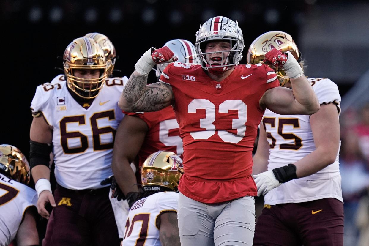 Nov 18, 2023; Columbus, Ohio, USA; Ohio State Buckeyes defensive end Jack Sawyer (33) celebrates a tackle during the first half of the NCAA football game against the Minnesota Golden Gophers at Ohio Stadium.