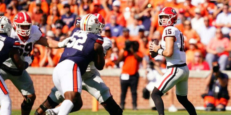 Sep 30, 2023; Auburn, Alabama, USA; Georgia Bulldogs quarterback Carson Beck (15) drops back to pass against the Auburn Tigers during the first quarter at Jordan-Hare Stadium. Mandatory Credit: John David Mercer-USA TODAY Sports