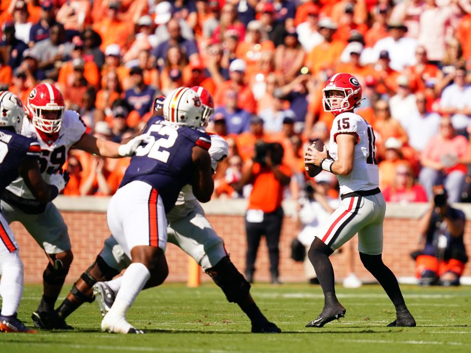 Sep 30, 2023; Auburn, Alabama, USA; Georgia Bulldogs quarterback Carson Beck (15) drops back to pass against the Auburn Tigers during the first quarter at Jordan-Hare Stadium. Mandatory Credit: John David Mercer-USA TODAY Sports