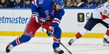 May 30, 2024; New York, New York, USA; New York Rangers defenseman K'Andre Miller (79) skates across center ice against the Florida Panthers during the first period in game five of the Eastern Conference Final of the 2024 Stanley Cup Playoffs at Madison Square Garden. Mandatory Credit: Dennis Schneidler-USA TODAY Sports