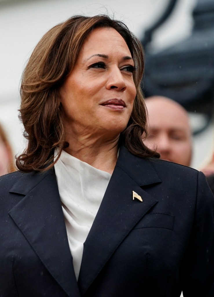 U.S. Vice President Kamala Harris, looks on during an event with the women and men's National Collegiate Athletic Association (NCAA) Champion teams in her first public appearance since President Joe Biden dropped out of the 2024 race, on the South Lawn of the White House, Washington, U.S., July 22, 2024. REUTERS/Nathan Howard
