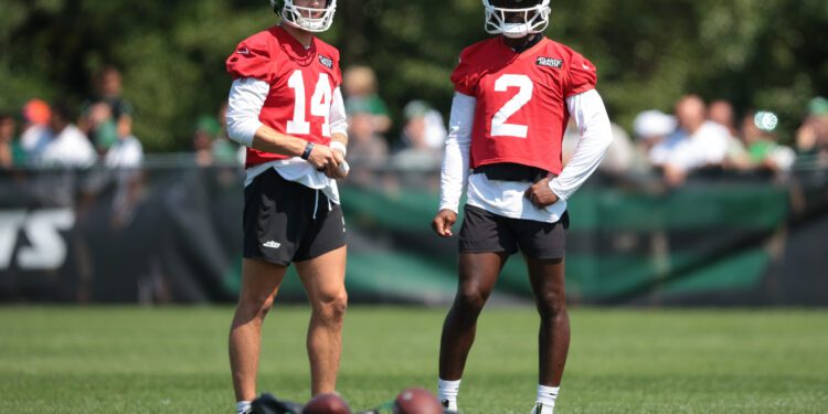 Jul 27, 2024; Florham Park, NJ, USA; New York Jets quarterback Andrew Peasley (14) and quarterback Tyrod Taylor (2) look on during training camp at Atlantic Health Jets Training Center. Mandatory Credit: Vincent Carchietta-USA TODAY Sports