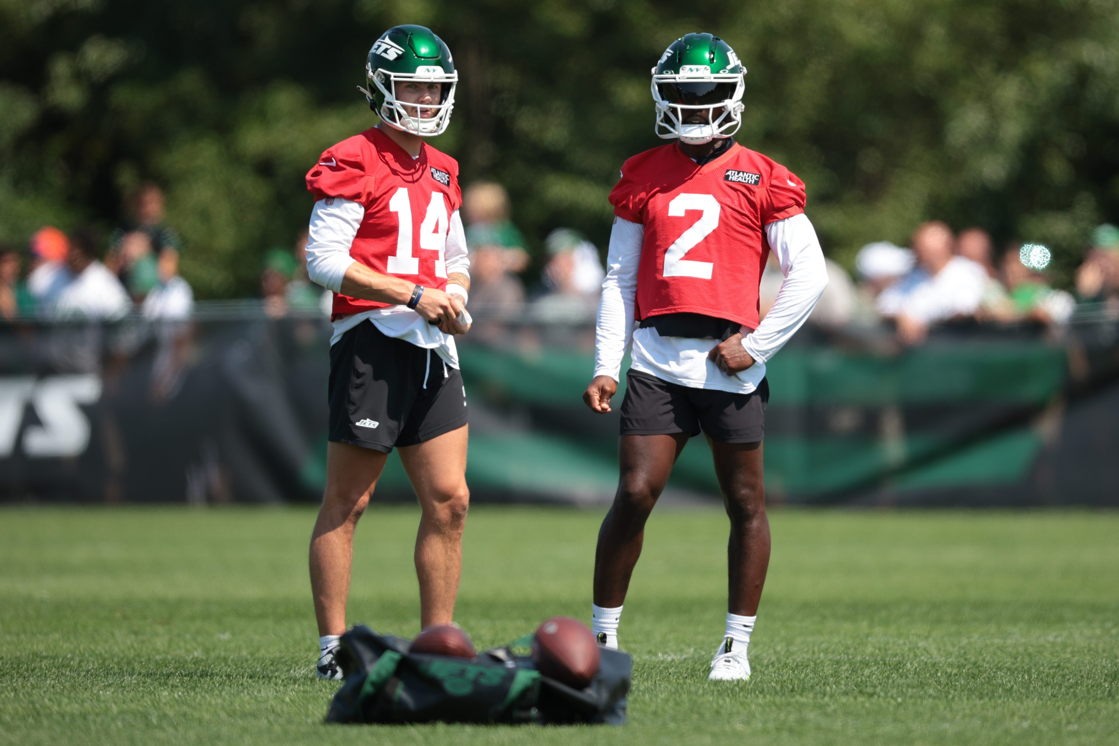 Jul 27, 2024; Florham Park, NJ, USA; New York Jets quarterback Andrew Peasley (14) and quarterback Tyrod Taylor (2) look on during training camp at Atlantic Health Jets Training Center. Mandatory Credit: Vincent Carchietta-USA TODAY Sports