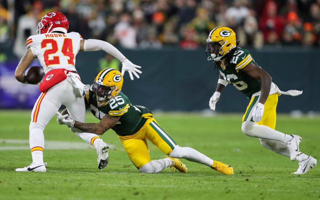 Green Bay Packers cornerback Keisean Nixon (25) tackles Kansas City Chiefs wide receiver Skyy Moore (24) on Sunday, December 3, 2023, at Lambeau Field in Green Bay, Wis. Tork Mason/USA TODAY NETWORK-Wisconsin