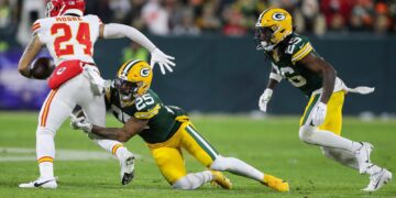 Green Bay Packers cornerback Keisean Nixon (25) tackles Kansas City Chiefs wide receiver Skyy Moore (24) on Sunday, December 3, 2023, at Lambeau Field in Green Bay, Wis. Tork Mason/USA TODAY NETWORK-Wisconsin