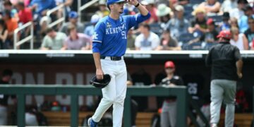 Jun 15, 2024; Omaha, NE, USA; Kentucky Wildcats starting pitcher Trey Pooser (51) walks off the field against the NC State Wolfpack after the fifth inning at Charles Schwab Filed Omaha. Mandatory Credit: Steven Branscombe-USA TODAY Sports