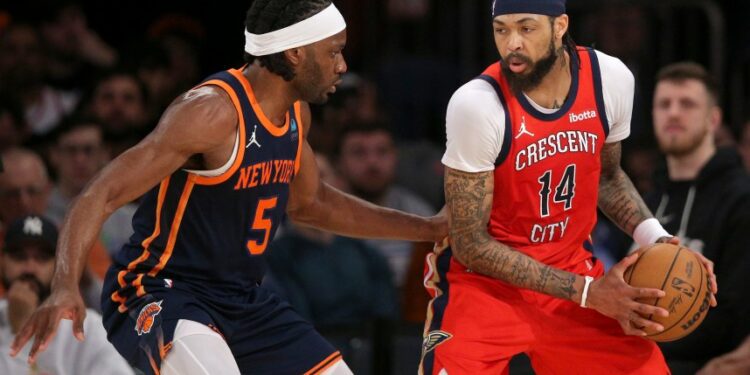 Feb 27, 2024; New York, New York, USA; New Orleans Pelicans forward Brandon Ingram (14) controls the ball against New York Knicks forward Precious Achiuwa (5) during the second quarter at Madison Square Garden. Mandatory Credit: Brad Penner-USA TODAY Sports