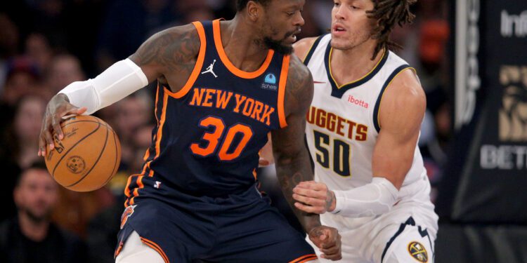 Jan 25, 2024; New York, New York, USA; New York Knicks forward Julius Randle (30) controls the ball against Denver Nuggets forward Aaron Gordon (50) during the first quarter at Madison Square Garden. Mandatory Credit: Brad Penner-USA TODAY Sports