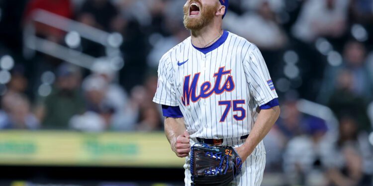 Jun 25, 2024; New York City, New York, USA; New York Mets relief pitcher Reed Garrett (75) reacts after getting the final out against the New York Yankees at Citi Field. Mandatory Credit: Brad Penner-USA TODAY Sports