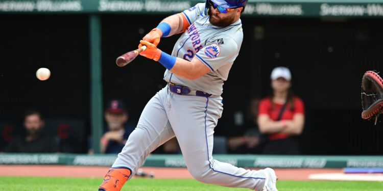 May 22, 2024; Cleveland, Ohio, USA; New York Mets right fielder DJ Stewart (29) hits a single during the first inning against the Cleveland Guardians at Progressive Field. Mandatory Credit: Ken Blaze-USA TODAY Sports