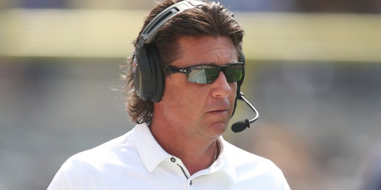 Mike Gundy wearing a headset