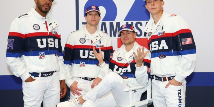 PARIS, FRANCE - JULY 23: Kareem Maddox, Jimmer Fredette, Dylan Travis and Canyon Barry try on clothes at the Team USA Welcome Experience Ahead of Paris 2024 on July 23, 2024 in Paris, France. (Photo by Joe Scarnici/Getty Images for USOPC) ORG XMIT: 776173500 ORIG FILE ID: 2163217112