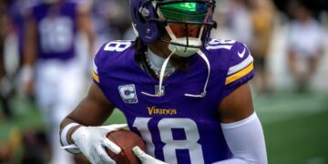 Oct 1, 2023; Charlotte, North Carolina, USA; Minnesota Vikings wide receiver Justin Jefferson (18) warms up before the game at Bank of America Stadium.