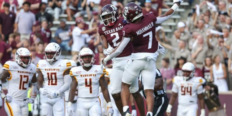 Sep 16, 2023; College Station, Texas; Texas A&M Aggies running back Rueben Owens (2) celebrates with wide receiver Moose Muhammad III (7) after scoring a touchdown during the third quarter against the Louisiana Monroe Warhawks at Kyle Field. Troy Taormina-USA TODAY Sports