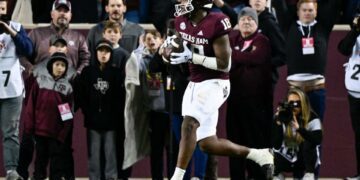 Nov 26, 2022; College Station, Texas, USA; Texas A&M Aggies tight end Donovan Green (18) catches a pass for a touchdown against the LSU Tigers during the second quarter at Kyle Field. Mandatory Credit: Jerome Miron-USA TODAY Sports