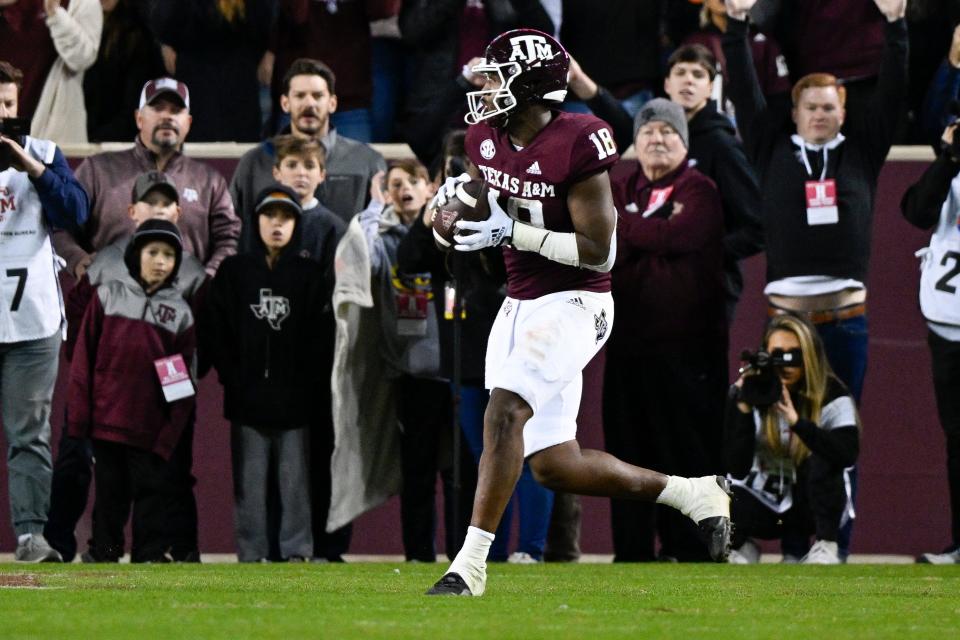 Nov 26, 2022; College Station, Texas, USA; Texas A&M Aggies tight end Donovan Green (18) catches a pass for a touchdown against the LSU Tigers during the second quarter at Kyle Field. Mandatory Credit: Jerome Miron-USA TODAY Sports