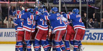 May 24, 2024; New York, New York, USA; New York Rangers center Barclay Goodrow (21) celebrates his game-winning overtime goal with teammates in game two of the Eastern Conference Final of the 2024 Stanley Cup Playoffs against the Florida Panthers at Madison Square Garden. Mandatory Credit: Vincent Carchietta-USA TODAY Sports