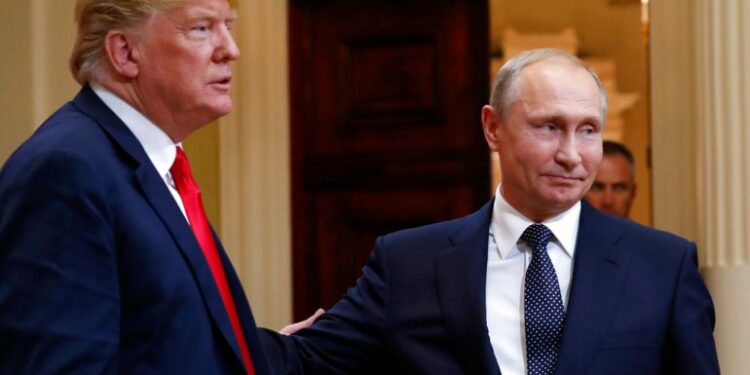 U.S. President Donald Trump, left, and Russian President Vladimir Putin leave a press conference after their meeting at the Presidential Palace in Helsinki, Finland, Monday, July 16, 2018. (AP Photo/Pablo Martinez Monsivais)