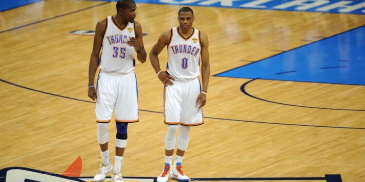 Jun 12, 2012; Oklahoma City, OK, USA; Oklahoma City Thunder small forward Kevin Durant (35) talks to point guard Russell Westbrook (0) during the second quarter of game one in the 2012 NBA Finals at Chesapeake Energy Arena. Mandatory Credit: Jerome Miron-USA TODAY Sports