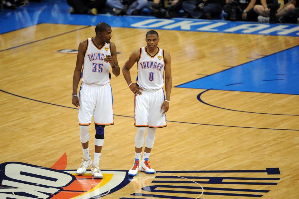 Jun 12, 2012; Oklahoma City, OK, USA; Oklahoma City Thunder small forward Kevin Durant (35) talks to point guard Russell Westbrook (0) during the second quarter of game one in the 2012 NBA Finals at Chesapeake Energy Arena. Mandatory Credit: Jerome Miron-USA TODAY Sports