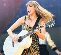 Taylor Swift performs onstage during the Eras Tour on July 13 in Milan, Roberto Cavalli, fringe minidress, Fausto Puglisi, ray of gold