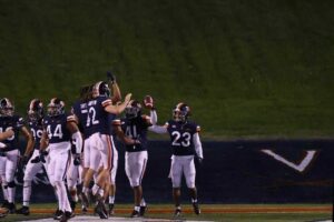 Nov 21, 2020; Charlottesville, Virginia, USA; Virginia Cavaliers linebacker D'Sean Perry (41) celebrates with teammates after returning an interception for a touchdown against the Abilene Christian Wildcats on the game's final play at Scott Stadium. Mandatory Credit: Geoff Burke-USA TODAY SportsGeoff Burke-USA TODAY Sports
