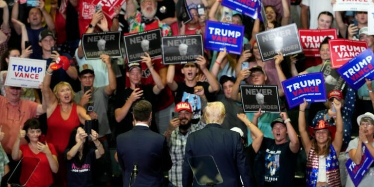 Republican presidential candidate former President Donald Trump, right, and Republican vice presidential candidate Sen. JD Vance, R-Ohio, attend a campaign event, Saturday, July 20, 2024, at Van Andel Arena in Grand Rapids, Mich.