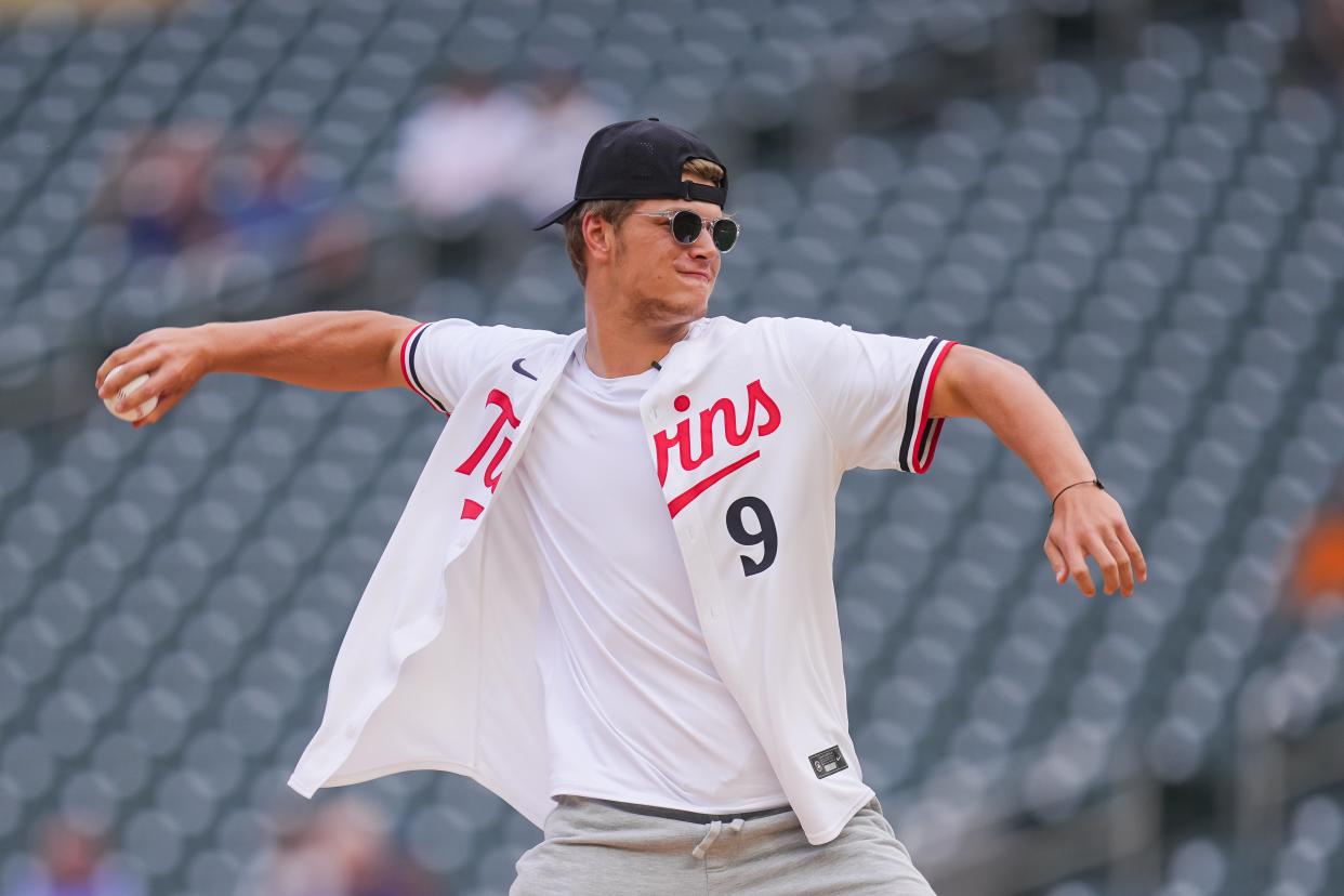 Jun 18, 2024; Minneapolis, Minnesota, USA; Minnesota Vikings first round draft pick JJ McCarthy throws out the ceremonial first pitch in a game between the Minnesota Twins and Tampa Bay Rays at Target Field. Mandatory Credit: Brad Rempel-USA TODAY Sports ORG XMIT: IMAGN-738378 ORIG FILE ID: 20240618_szo_ai9_0073.JPG