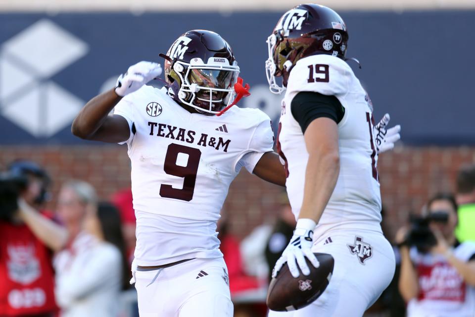 Nov 4, 2023; Oxford, Mississippi, USA; Texas A&M Aggies wide receiver Jahdae Walker (9) races with tight end Jake Johnson (19) after a touchdown during the second half against the Mississippi Rebels at Vaught-Hemingway Stadium. Mandatory Credit: Petre Thomas-USA TODAY Sports