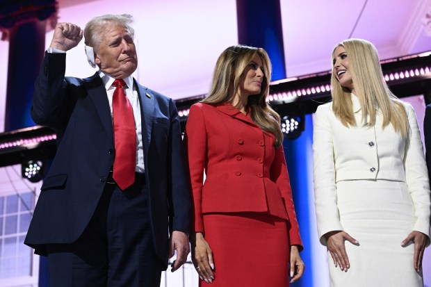 (From L) US former President and 2024 Republican presidential candidate Donald Trump raises a fist next to former US First Lady Melania Trump and daughter Ivanka Trump during the last day of the 2024 Republican National Convention at the Fiserv Forum in Milwaukee, Wisconsin, on July 18, 2024. Donald Trump will get a hero's welcome Thursday as he accepts the Republican Party's nomination to run for US president in a speech capping a convention dominated by the recent attempt on his life. (Photo by Brendan SMIALOWSKI / AFP) (Photo by BRENDAN SMIALOWSKI/AFP via Getty Images)