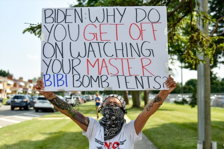 DETROIT, MICHIGAN, UNITED STATES - JULY 12: A few dozen pro Palestinian activists gather outside the A. Phillip Randolph Vocational Technical Center in Detroit, Michigan on July 12, 2024 to protest the Biden administration’s support for Israeli attacks on Gaza and express concerns over his age and cognitive decline to attendees entering the Biden campaign rally. photo Adam J. Dewey