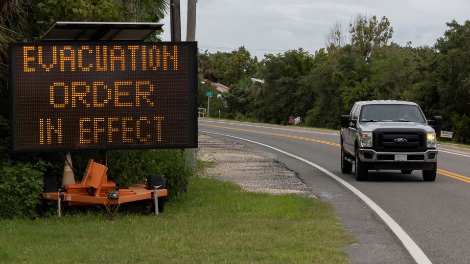 An evacuation order warning sign is seen on August 4 in Cedar Key, Florida, ahead of Debby's expected landfall in the state. - Ricardo Arduengo/Reuters