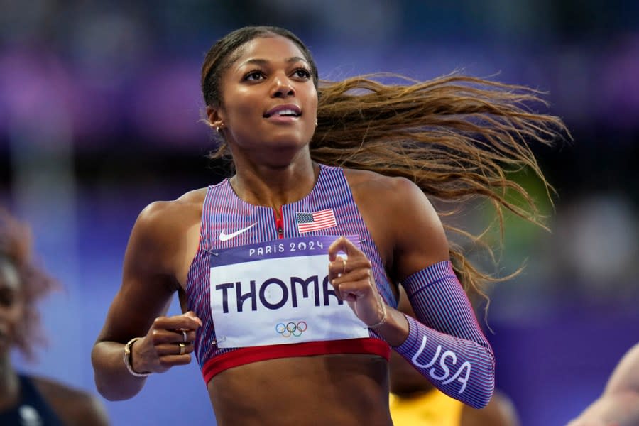 Gabrielle Thomas, of the United States, leads the field to win her women's 200-meters semifinal at the 2024 Summer Olympics, Monday, Aug. 5, 2024, in Saint-Denis, France. (AP Photo/Petr David Josek)