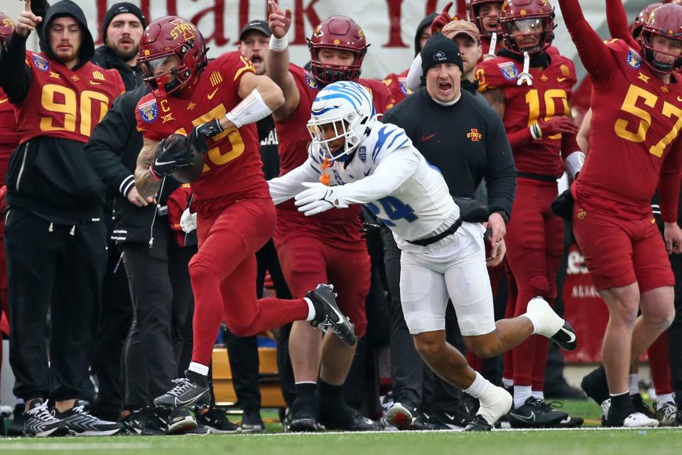 Dec 29, 2023; Memphis, TN, USA; Iowa State Cyclones wide receiver Jaylin Noel (13) runs after a catch as Memphis Tigers defensive back Greg Rubin (24) shoves him out of bounds during the first half at Simmons Bank Liberty Stadium. Mandatory Credit: Petre Thomas-USA TODAY Sports