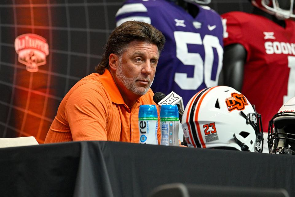 Jul 12, 2023; Arlington, TX, USA; Oklahoma State head coach Mike Gundy is interviewed during Big 12 football media day at AT&T Stadium. Mandatory Credit: Jerome Miron-USA TODAY Sports