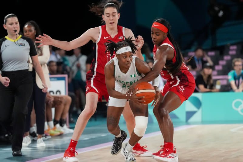 Team USA's Breanna Stewart (L) and Jackie Young (R) defend Nigeria's Ezinne Kalu during a Summer Olympics women's basketball quarterfinal Wednesday in Paris. Photo by Richard Ellis/UPI