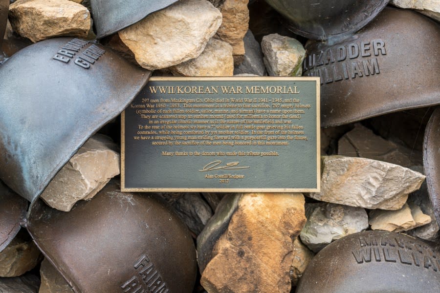 Zanesville, OH – Sept. 8, 2021: Description of the WWII Korean War Memorial honoring the fallen men from Muskingum County by sculptor Alan Cottrill.