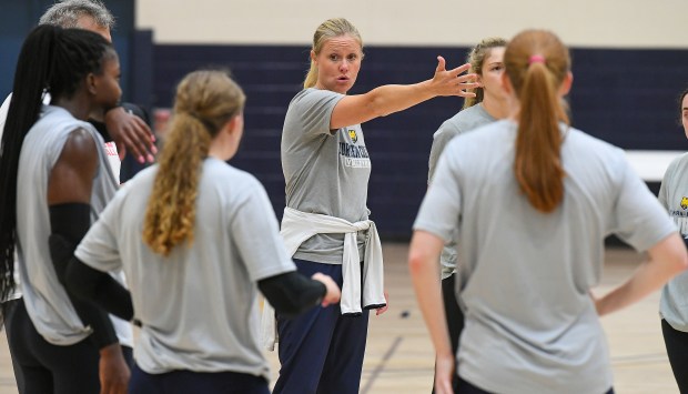 University of Northern Colorado head volleyball coach Lyndsey Oates talks with her team during practice on the UNC campus Thursday Aug. 8, 2024.(Jim Rydbom/Staff Photographer)